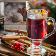 Warm mulled wine in a glass at Old Ground Hotel, surrounded by festive decor.