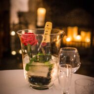 Romantic table setting with champagne and rose at cosy Old Ground Hotel.
