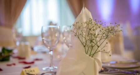 Elegant table setting with flowers and wine glasses at Old Ground Hotel.
