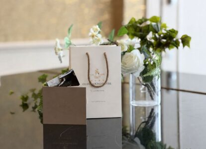 Elegant gift bags and floral decor at Old Ground Hotel lounge.